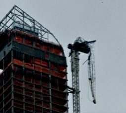 one57 flipped-over crane arm dangles above 57th Street near Carnegie Hall photo by Nancy Malitz