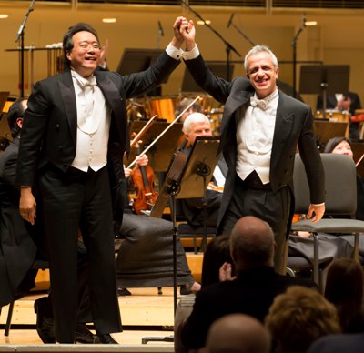 Yo-Yo Ma and Giovanni Sollima take a bow after the world premiere of Sollima's 'Antidotum Tarantulae XXI' double cello concerto, which he wrote for the Chicago Symphony. (Todd Rosenberg)
