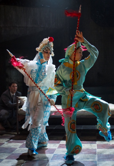 Dancers perform stylized combat in 'M. Butterfly' at Court Theatre. (Michael Brosilow)