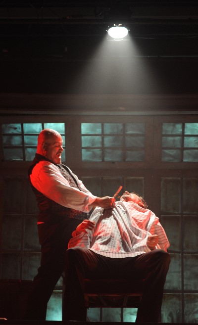 Sweeney Todd (David Girolmo) unleashes his razor on unsuspecting customers. (Brandon Dahlquist)