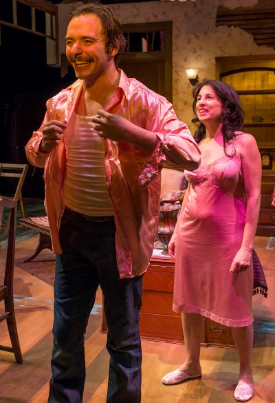 Alvaro (Nic Grelli) tries on a pink silk shirt on loan from Serafina (Eileen Niccolai). (Michael Brosilow)
