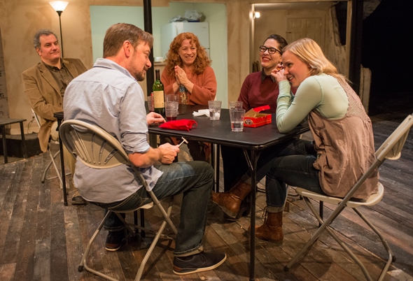Boyfriend Richard (Lance Baker, foreground) learns a family tradition from the Blakes, from left, Erik (Keith Kupferer), Deirdre (Hanna Dworkin), Aimee (Sadieh Rifai) and Brigid (Kelly O'Sullivan). (Michael Brosilow)