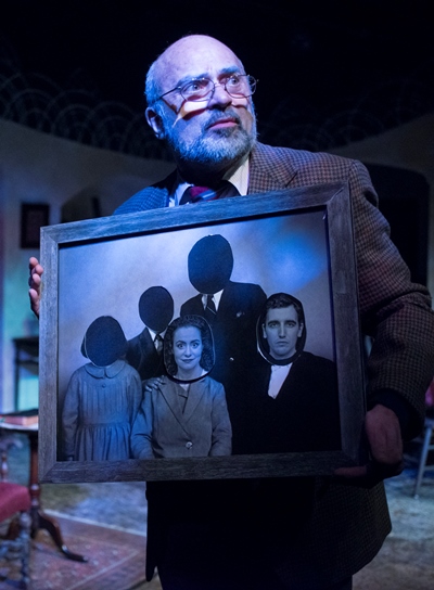 The Gentleman narrator (Ron Quade) gives the audience a close look at Tomasian's macabre family photo. (Dean LaPrairie)