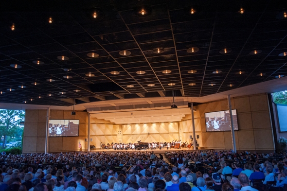 Big screens, a lawn crowd and train engines are part of the Ravinia Festival experience when Conlon conducts the Chicago Symphony. (Patrick Gipson)