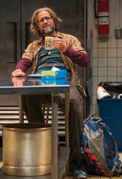 Frog (Tim Hopper) makes himself at home in the soup kitchen. (Michael Brosilow)