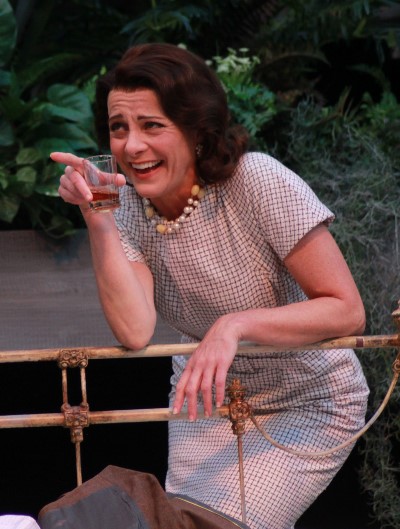 Blanche (Tracy Michelle Arnold) enjoys a drink and a laugh during a peaceful moment in her stay with her sister Stella (Carissa Dixon)