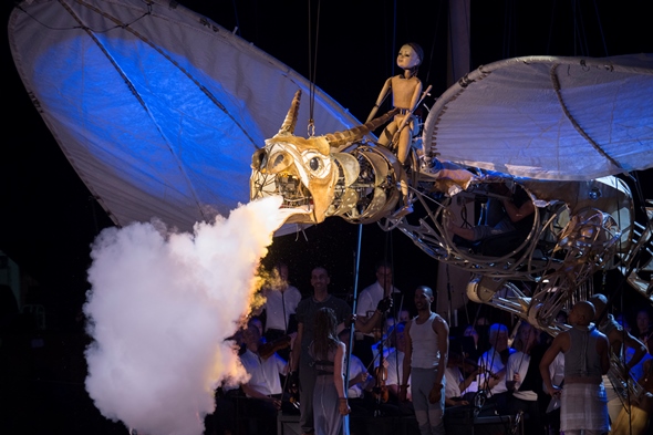 A wooden puppet mounts the smoke-breathing dragon in final triumph. (Patrick Gipson/Ravinia)