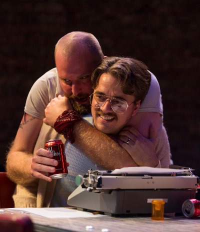 Lee (Joseph Wiens) is attached to his beer while Austin (Kevin Viol) sticks to his typewriter. (Michael Brosilow)