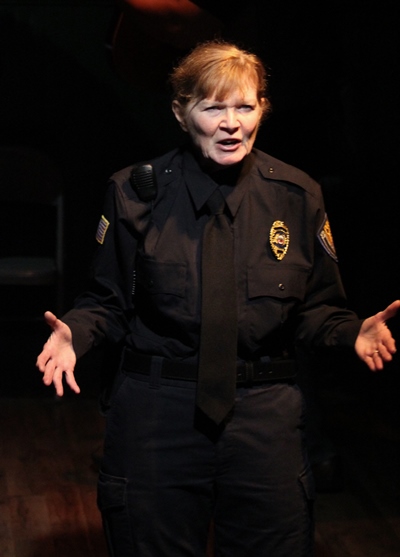 Officer Darla London (Melissa Riemer) relates the sad tale of Bobbie Clearly. (Gregg Gilman)