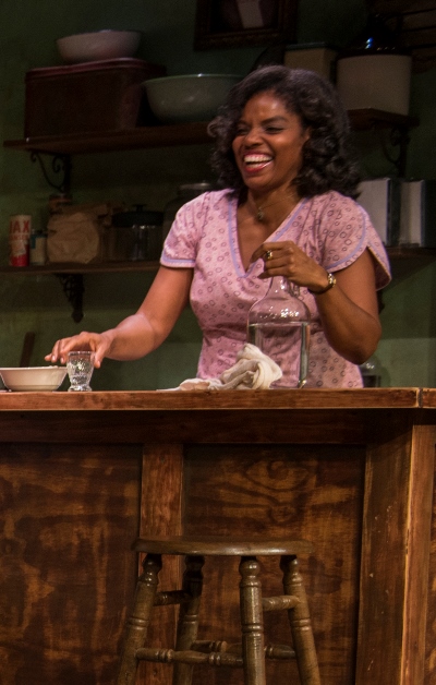 Charlesetta (Tyla Abercrumbie) supplies drinks and affection at her little cafe. (Michael Brosilow)