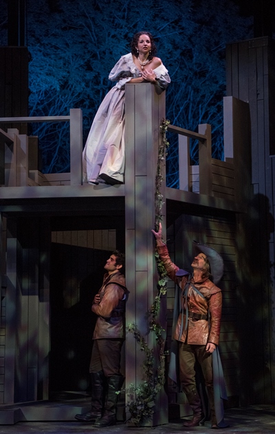 The enchanted Roxane (Laura Rook) listens to the unsuspected Cyrano (James Ridge, lower right) giving voice to the love of Christian (Danny Martinez). (Michael Brosilow)