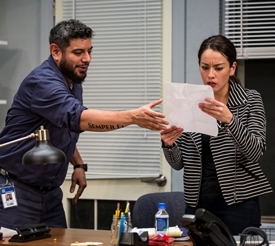 Lucia (Sari Sanchez) sees that she can help Abel (Eddie Martinez) in his quest for promotion. (Liz Lauren)