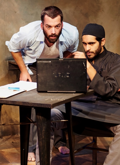 Nick (Joel Reitsma) and Bashir (Owais Ahmed) await the results of their market move. (Lee Miller)