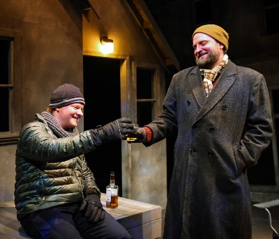 On a cold night, brothers Jamie (Steve Peebles, left) and Rufus (Joseph Wiens) share a toast. (Evan Hanover)